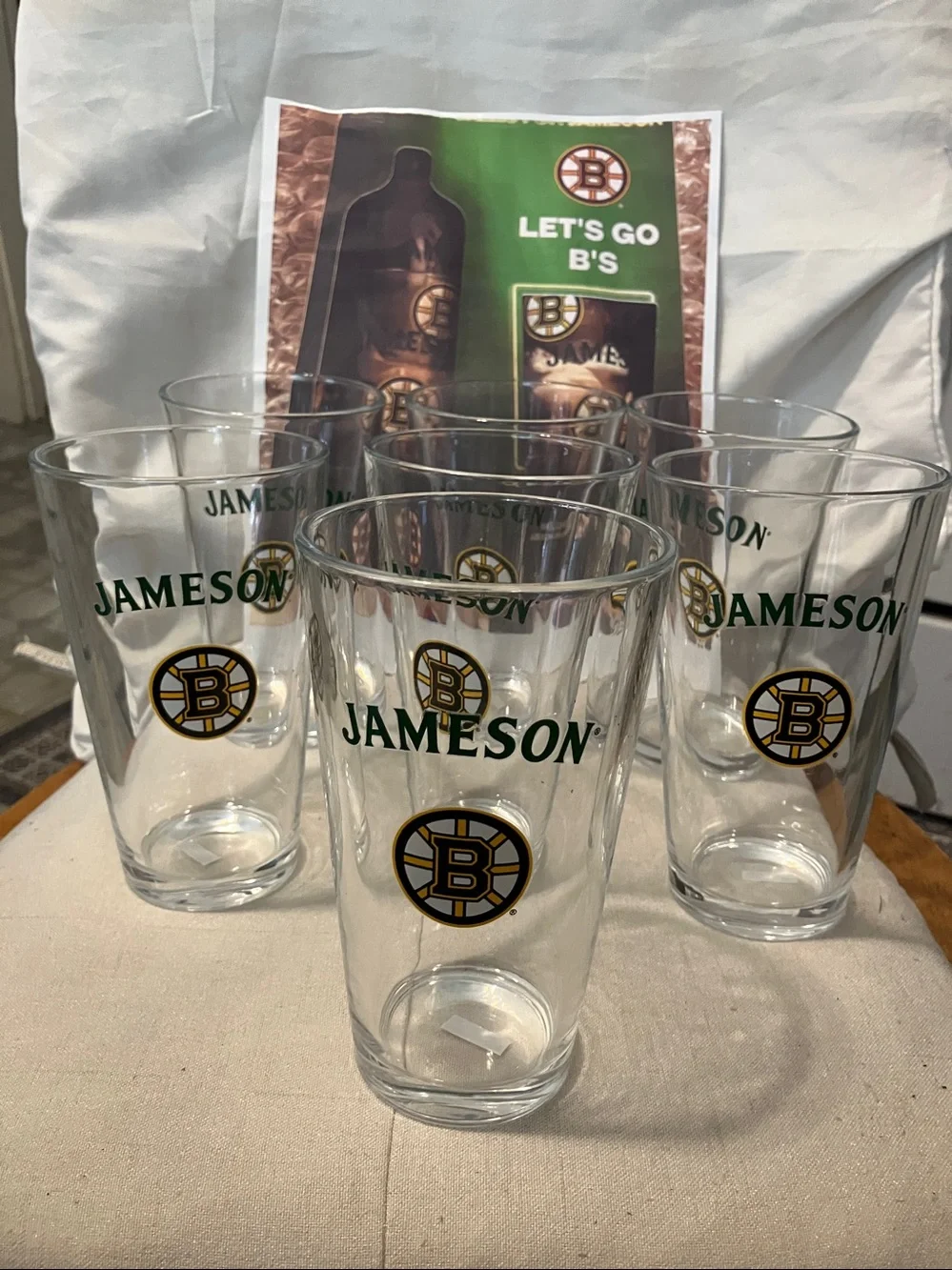 New. Set of 7 pint size glasses with Jameson - Boston Bruins logo on front
